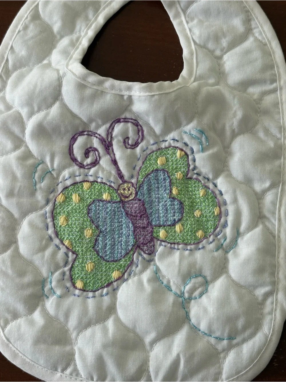 Hand embroidered butterfly quilted baby bib